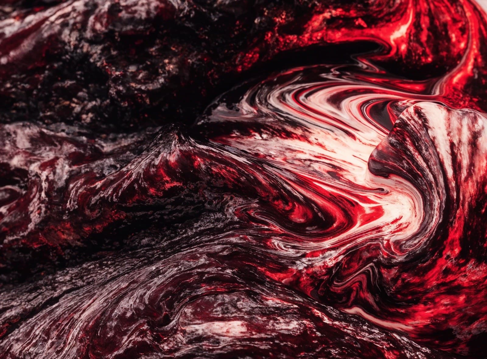 Abstract magma texture in red, black and cream